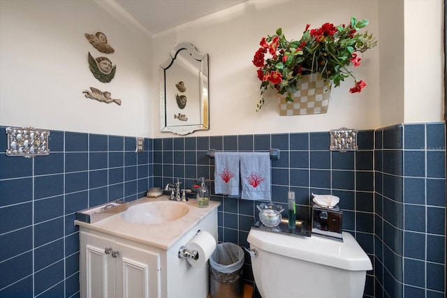 bathroom featuring tile walls, oversized vanity, tasteful backsplash, and toilet