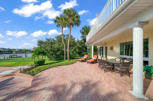 view of patio / terrace featuring a balcony and a water view