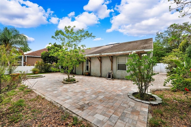 rear view of property with a patio