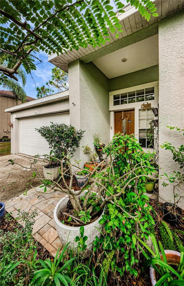 doorway to property featuring a garage