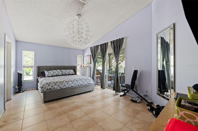 bedroom with lofted ceiling, light tile patterned floors, a textured ceiling, and a chandelier