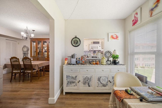 interior space with hardwood / wood-style flooring and a chandelier