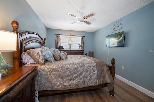 bedroom with ceiling fan, a textured ceiling, baseboards, and wood finished floors