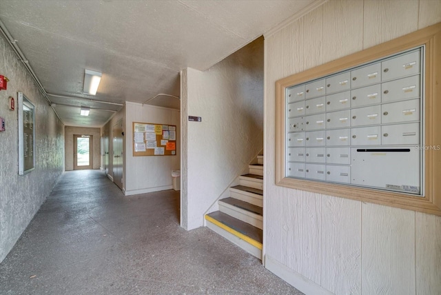 interior space with a textured ceiling and mail boxes