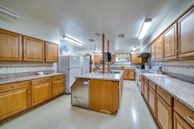 kitchen featuring light floors, white appliances, light countertops, and visible vents