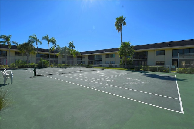 view of sport court featuring fence