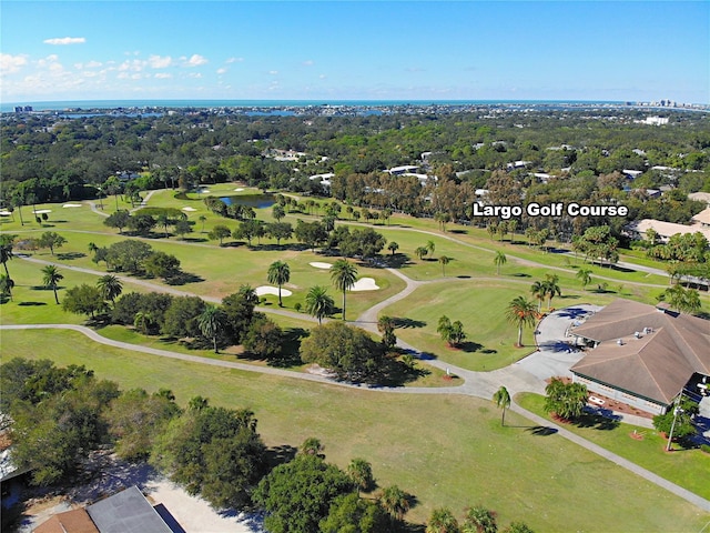 drone / aerial view featuring view of golf course and a water view