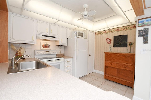 kitchen with white cabinets, white appliances, and light tile patterned floors