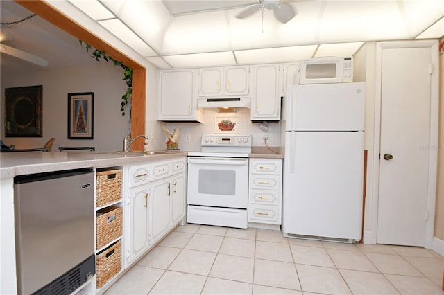 kitchen featuring white cabinetry, ceiling fan, white appliances, light tile patterned floors, and backsplash