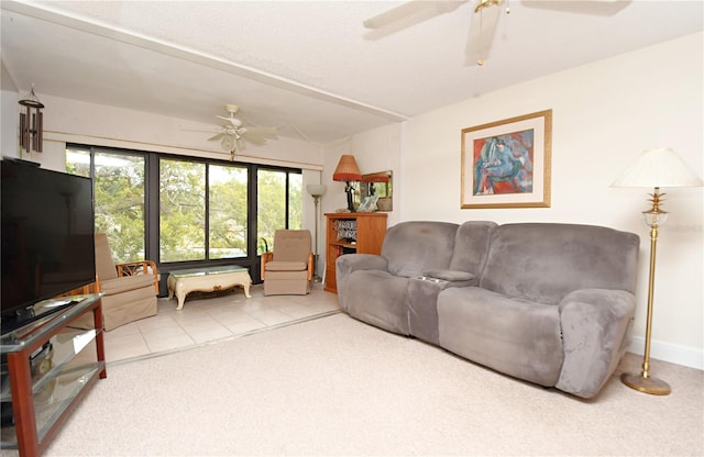 tiled living room with lofted ceiling and ceiling fan