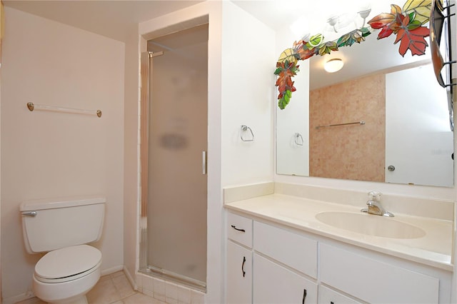 bathroom with vanity, walk in shower, tile patterned flooring, and toilet