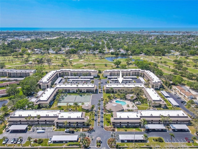 birds eye view of property featuring view of golf course and a water view