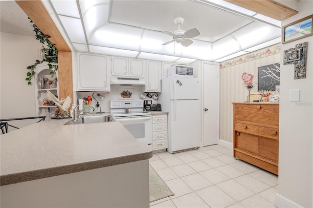 kitchen with white appliances, under cabinet range hood, a sink, ceiling fan, and white cabinets