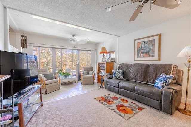tiled living area featuring a textured ceiling and ceiling fan