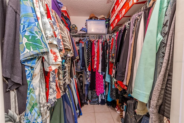 walk in closet featuring tile patterned flooring