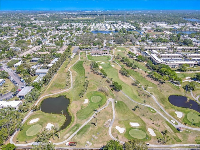 bird's eye view with view of golf course and a water view