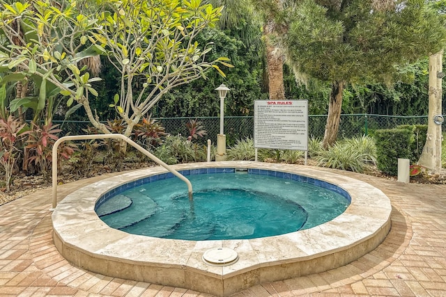 view of pool with a community hot tub