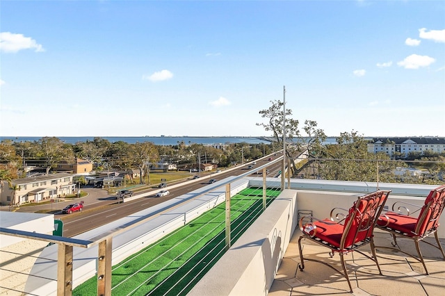 balcony featuring a water view