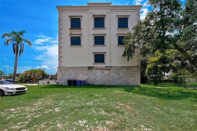 view of home's exterior with a lawn