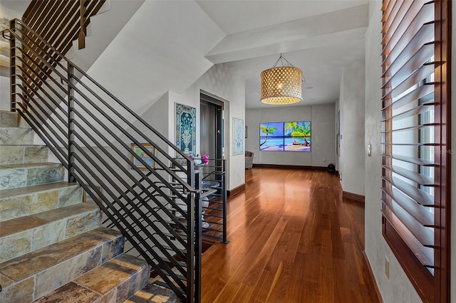 interior space with hardwood / wood-style floors and a notable chandelier