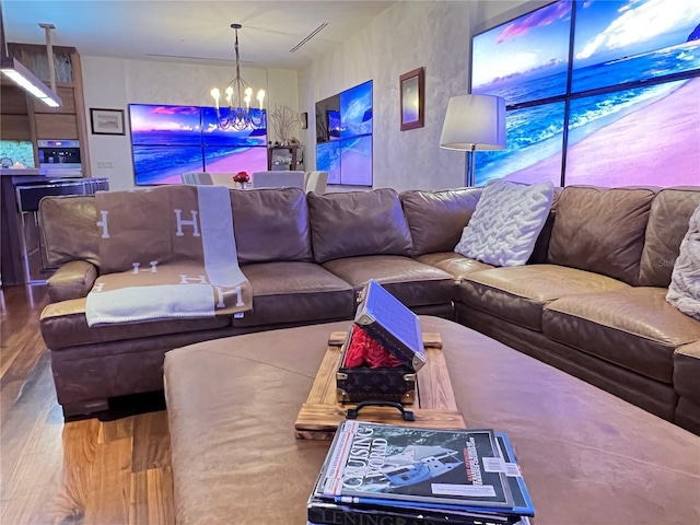 living room featuring hardwood / wood-style floors and a chandelier