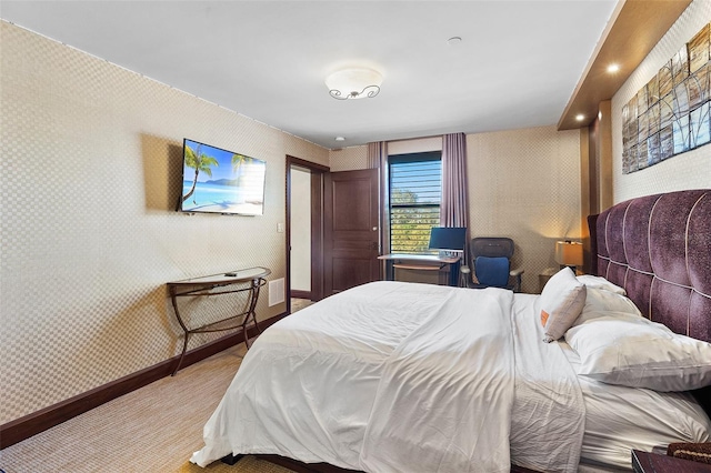 bedroom featuring light carpet