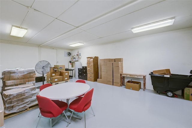 interior space with gas water heater and concrete floors