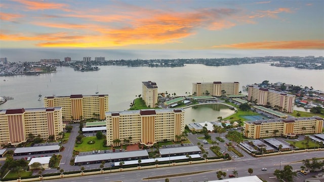 aerial view at dusk with a water view