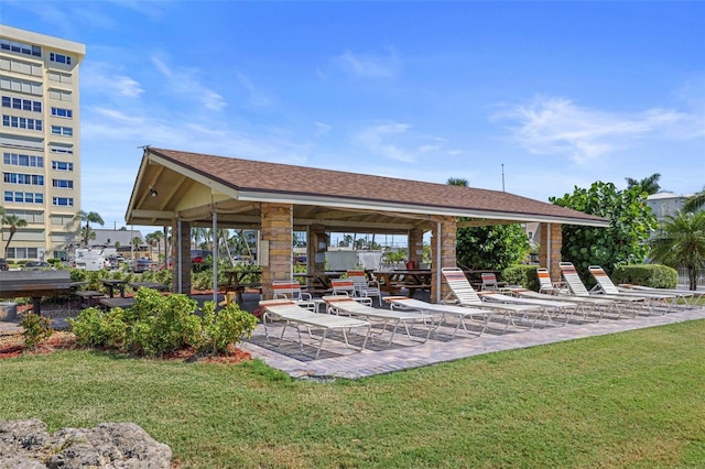 view of nearby features featuring a lawn and a patio