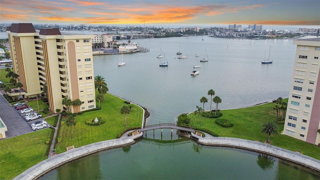 aerial view at dusk with a water view