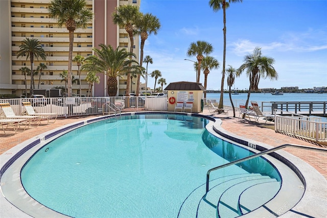 view of pool featuring a water view