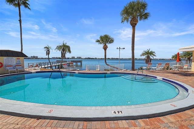 view of swimming pool with a water view