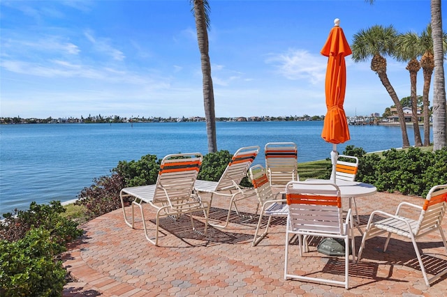 view of patio with a water view