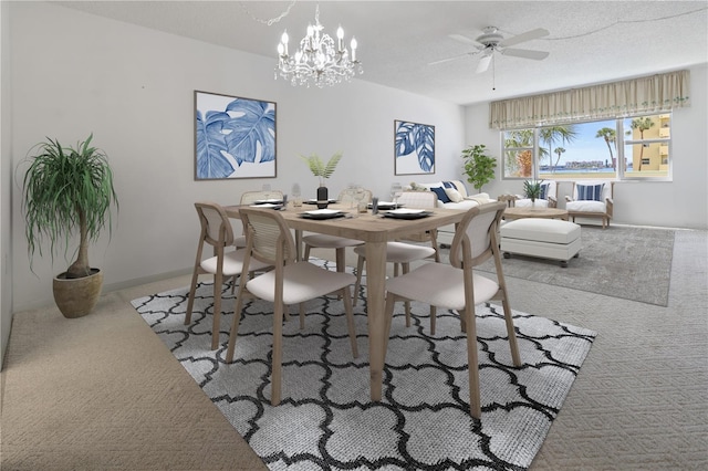 dining room featuring light carpet, a textured ceiling, and ceiling fan with notable chandelier