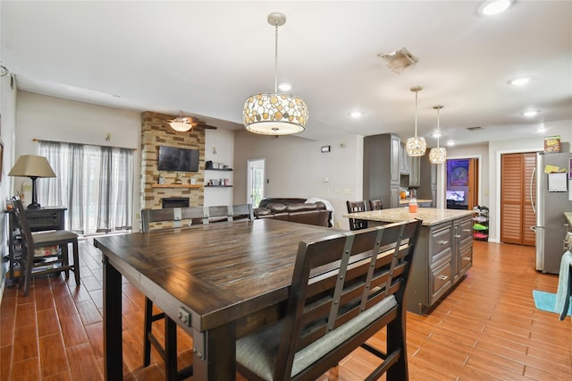 dining space featuring a notable chandelier and hardwood / wood-style flooring