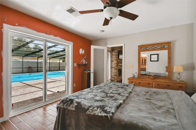 bedroom with access to exterior, ceiling fan, and light wood-type flooring