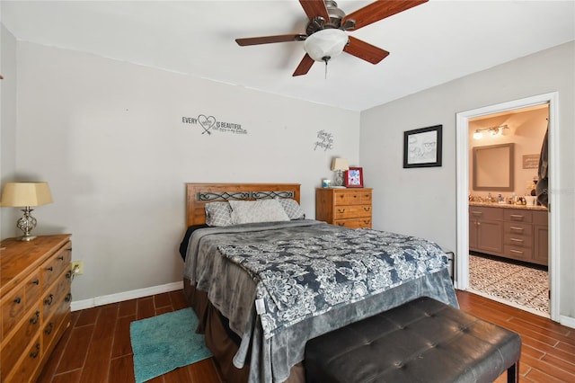 bedroom with dark hardwood / wood-style flooring, ceiling fan, and ensuite bathroom