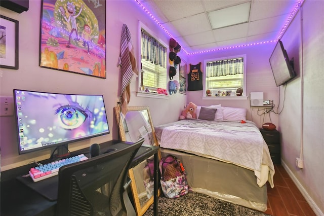 bedroom featuring a paneled ceiling