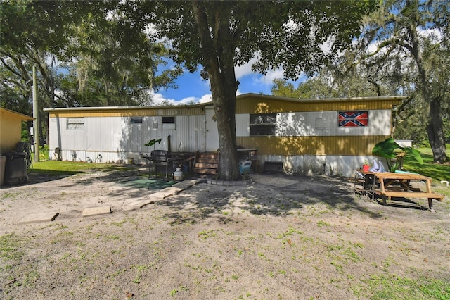 back of property with a patio