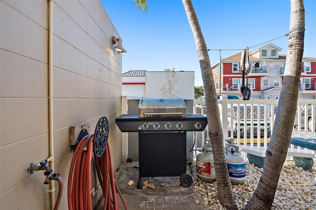 view of patio / terrace featuring a grill and a balcony