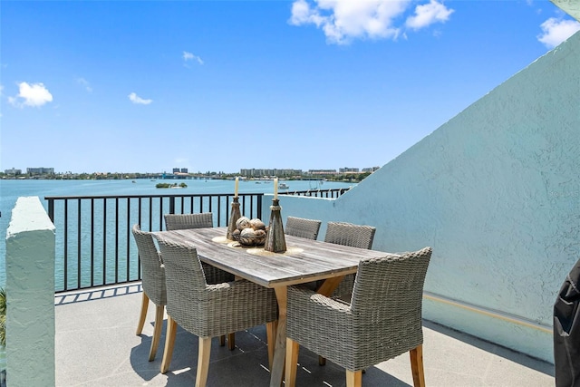 view of patio with a water view