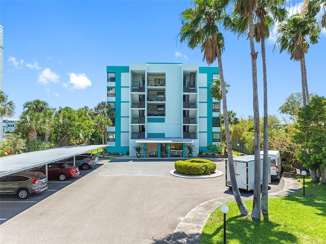 1848 Shore Dr S Unit 501, South Pasadena, FL 33707 - view of property featuring covered and uncovered parking