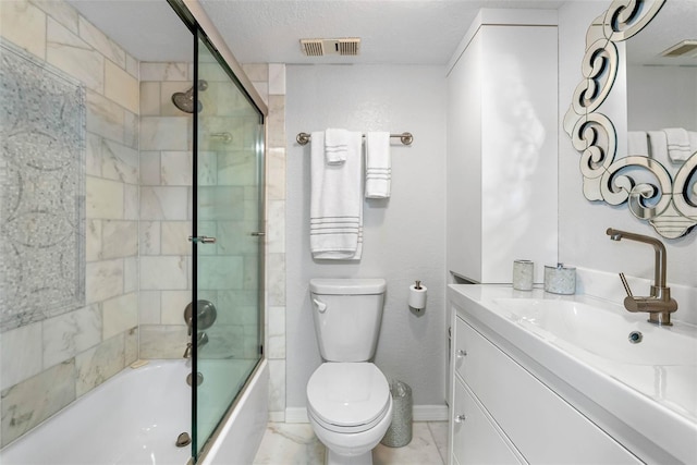 full bathroom featuring vanity, a textured ceiling, shower / bath combination with glass door, and toilet