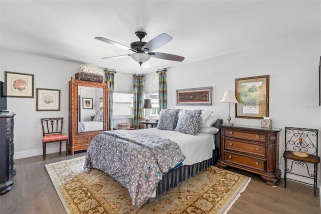 bedroom featuring dark wood-type flooring and ceiling fan