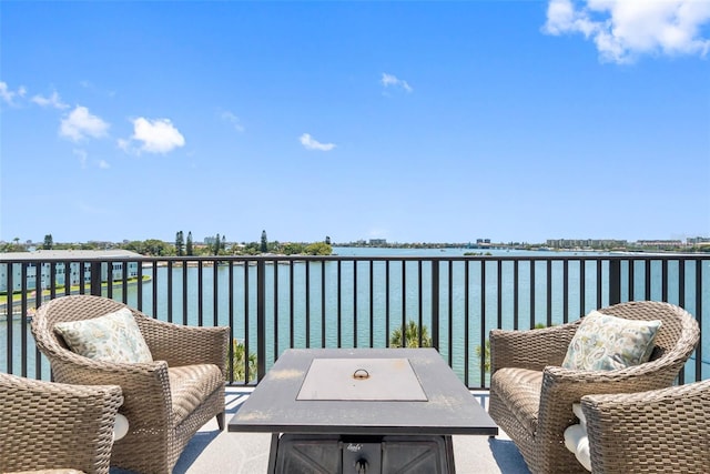 balcony featuring a water view