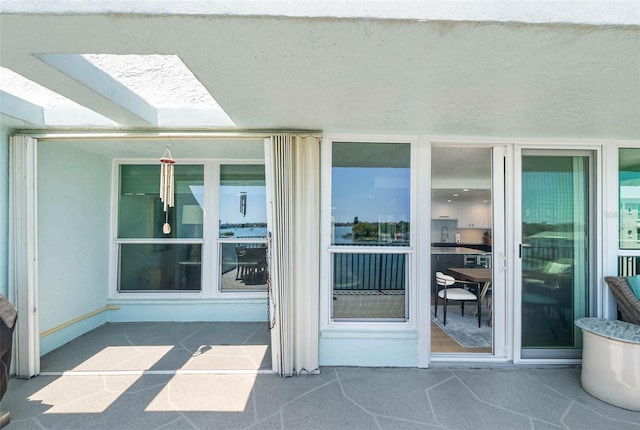 entrance to property with a patio