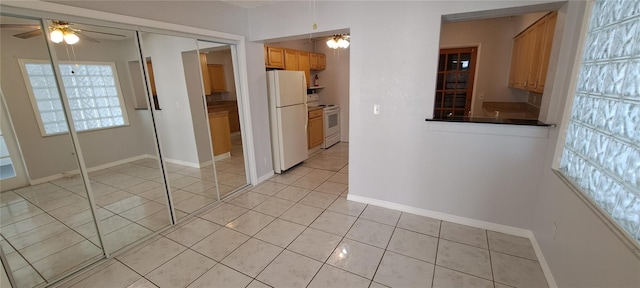 interior space featuring plenty of natural light and light tile floors