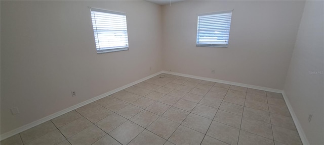 empty room featuring light tile flooring