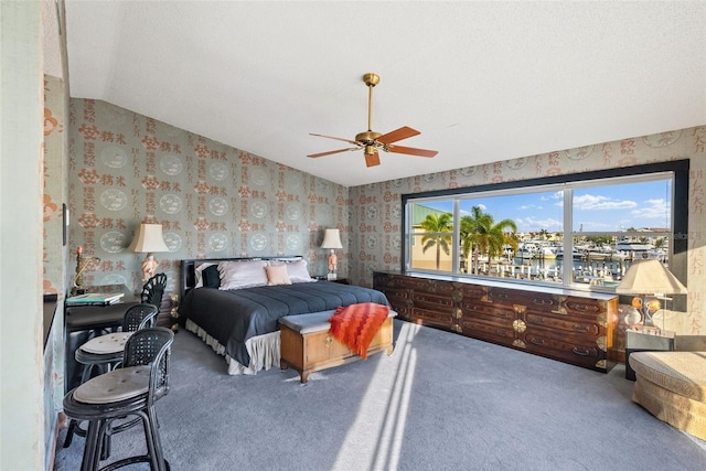 bedroom featuring carpet flooring, ceiling fan, and vaulted ceiling