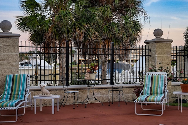 view of patio terrace at dusk